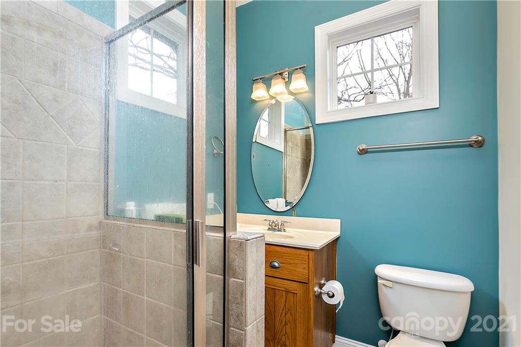 21036 Rio Oro Drive Cornelius, NC 28031 - Photo 23 of 29 a bathroom with a toilet sink and mirror
