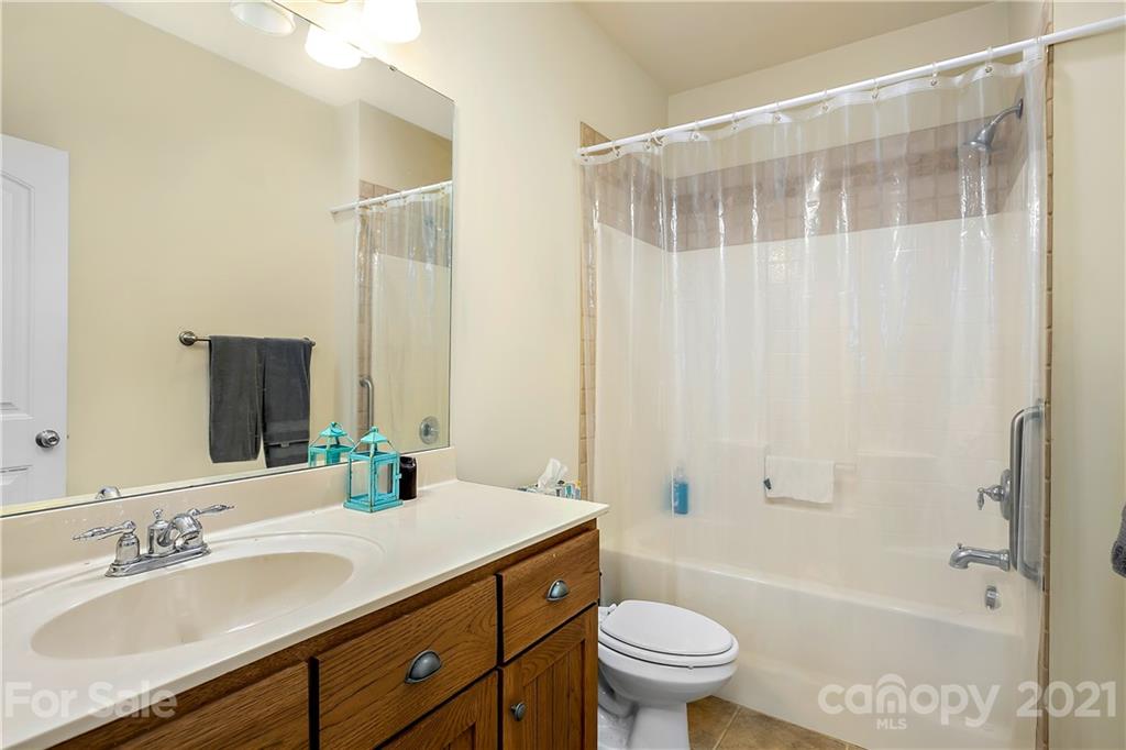 21036 Rio Oro Drive Cornelius, NC 28031 - Photo 10 of 29 a bathroom with a sink a toilet and shower