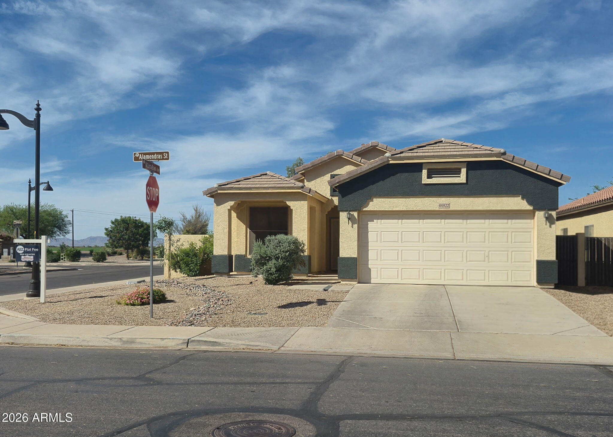 44922 Alamendras Street Maricopa, AZ 85139 - Photo 1 of 26 a front view of a house with a yard