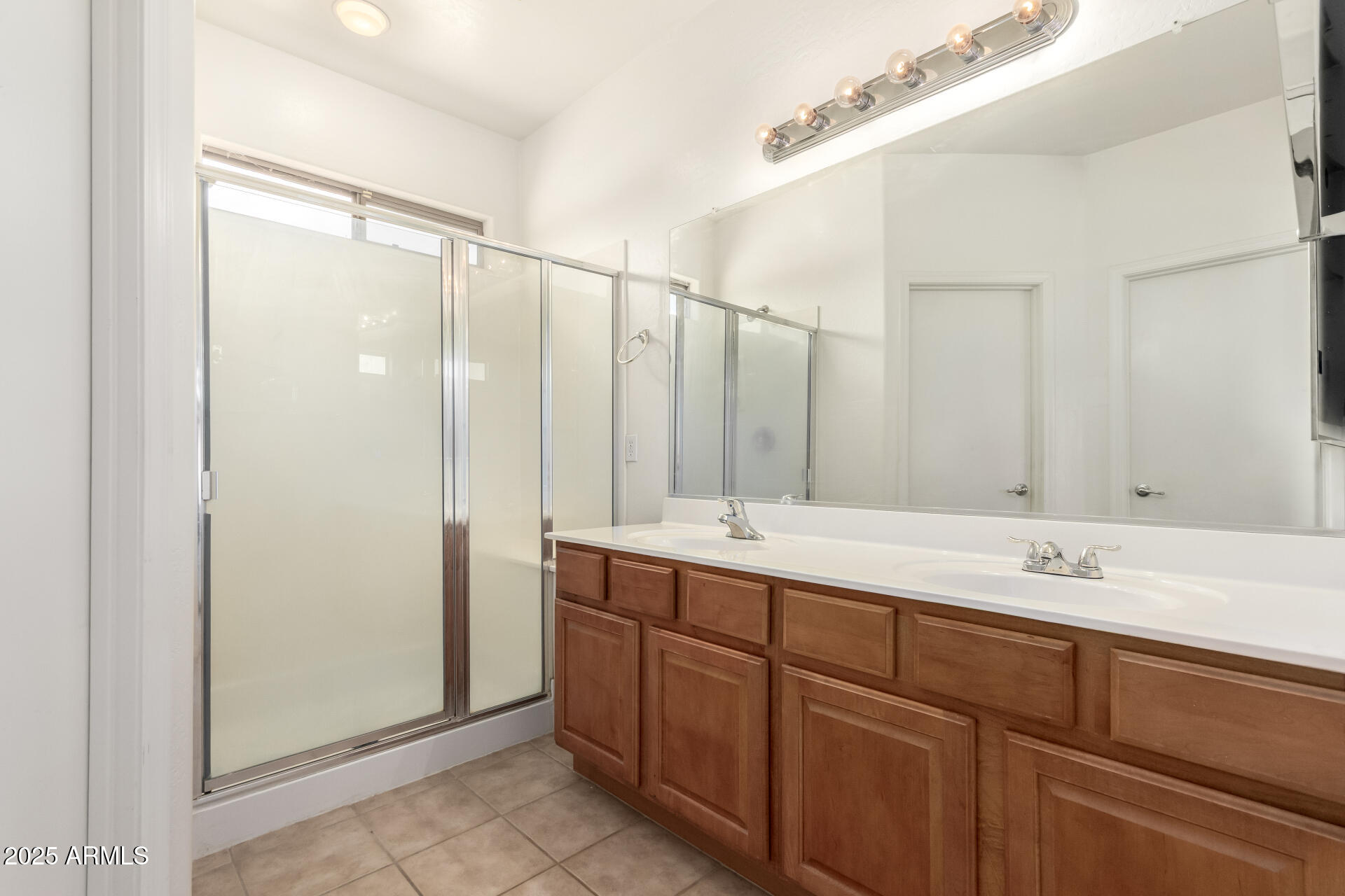44922 Alamendras Street Maricopa, AZ 85139 - Photo 13 of 26 a bathroom with a double vanity sink mirror and double