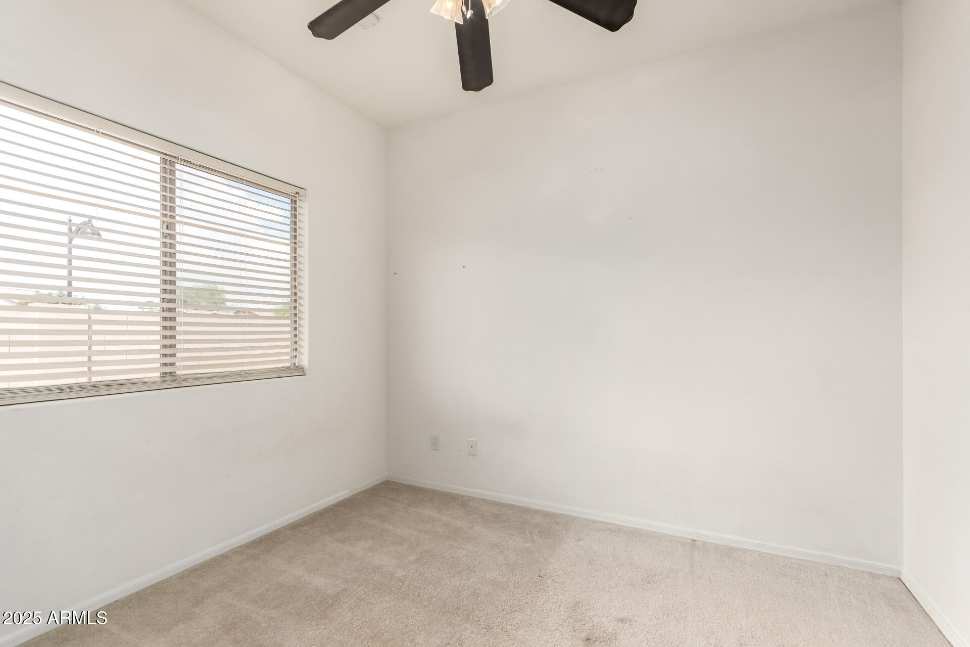 44922 Alamendras Street Maricopa, AZ 85139 - Photo 16 of 26 an empty room with windows