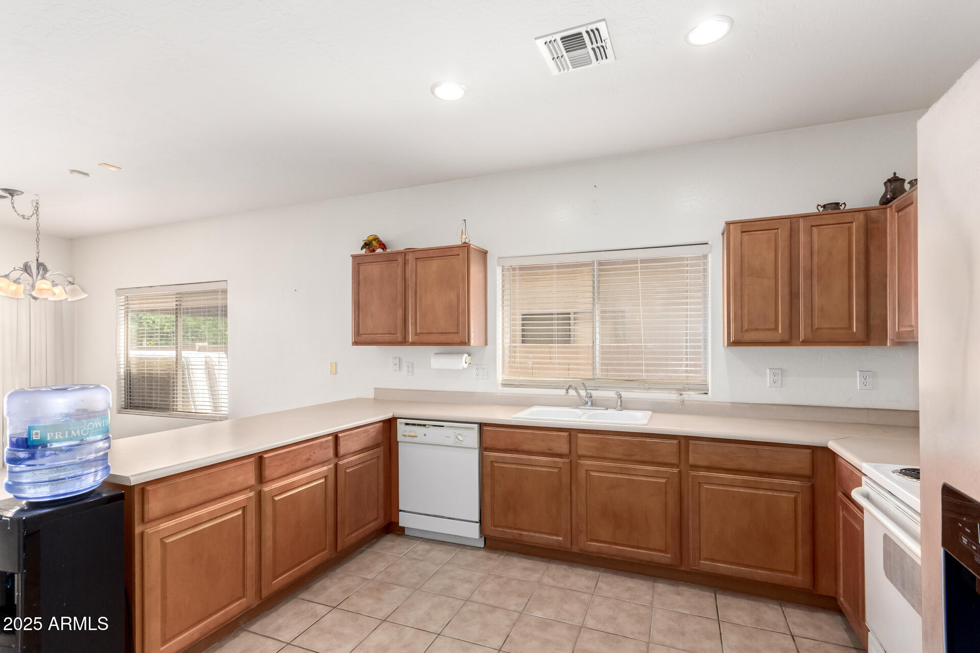 44922 Alamendras Street Maricopa, AZ 85139 - Photo 8 of 26 a kitchen with a sink stove and cabinets