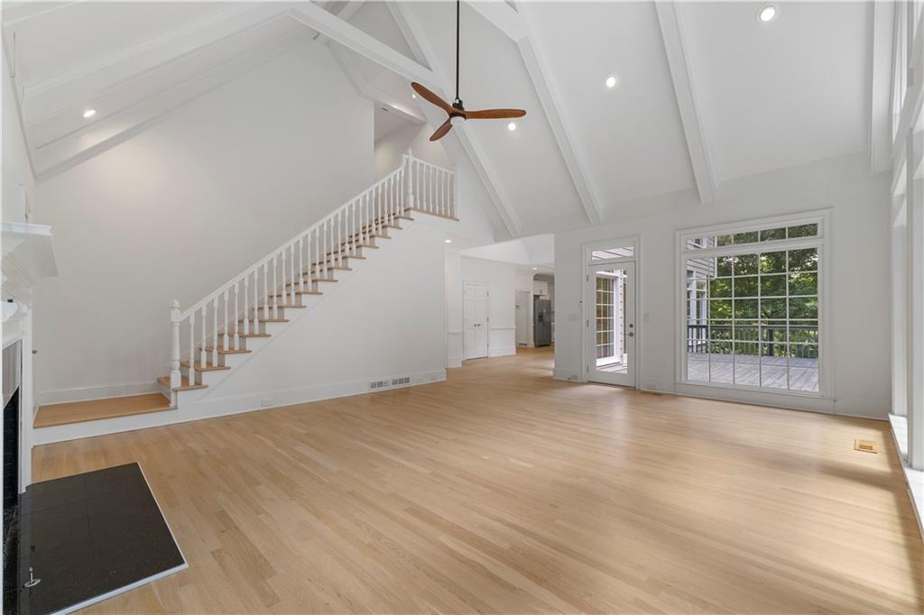 8965 Laurel Way Alpharetta, GA 30022 - Photo 10 of 79 a view of an empty room with wooden floor and a window
