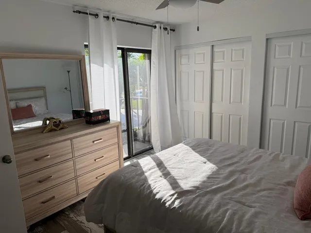 a backyard of a house with barbeque oven table and chairs