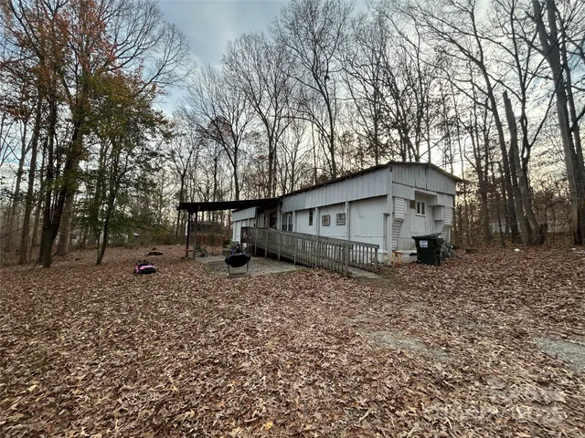 a fire hydrant sitting in the middle of a forest