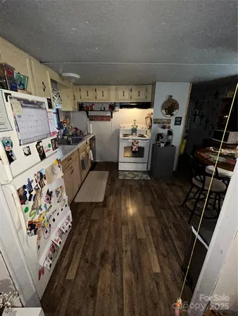 a kitchen with storage and utility