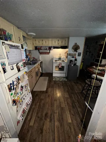 a kitchen with storage and utility
