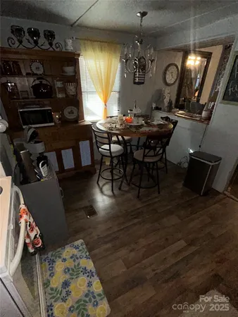 a dining room with furniture and window