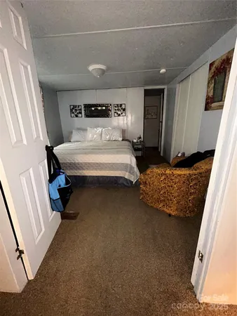 a bedroom with bed and window