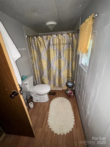 a bathroom with a sink and toilet