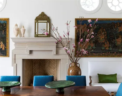 a living room with furniture a lamp and a fireplace
