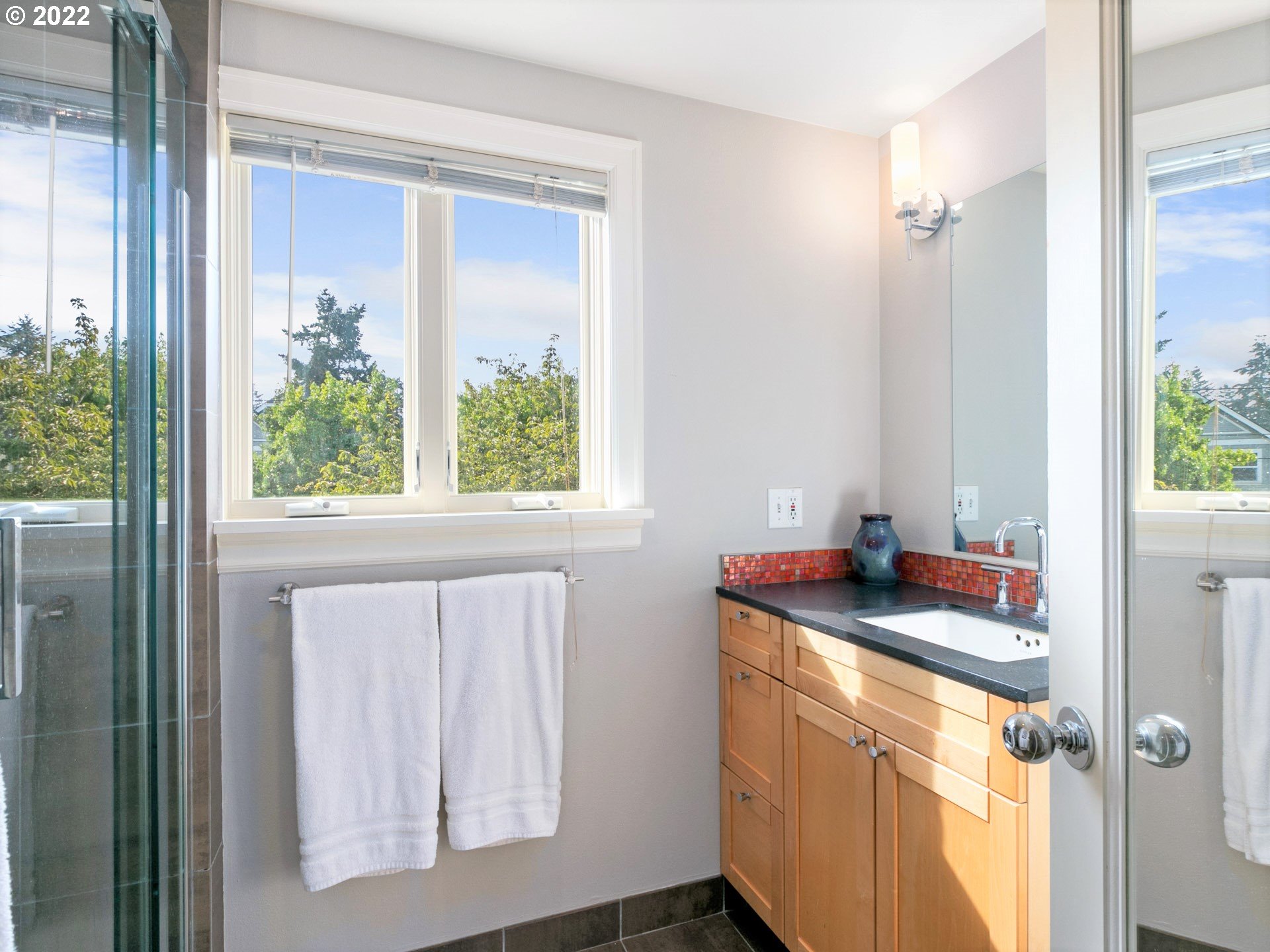 1742 Northeast 60th Avenue Portland, OR 97213 - Photo 20 of 32 a bathroom with a granite countertop sink and a window