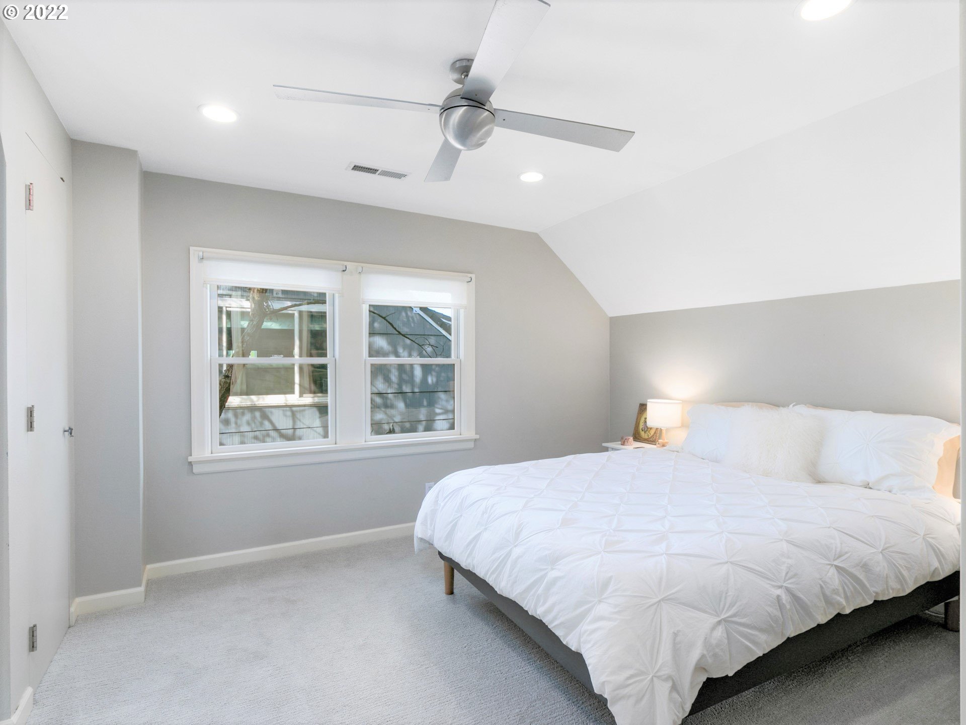 1742 Northeast 60th Avenue Portland, OR 97213 - Photo 21 of 32 a bedroom with a bed and a window