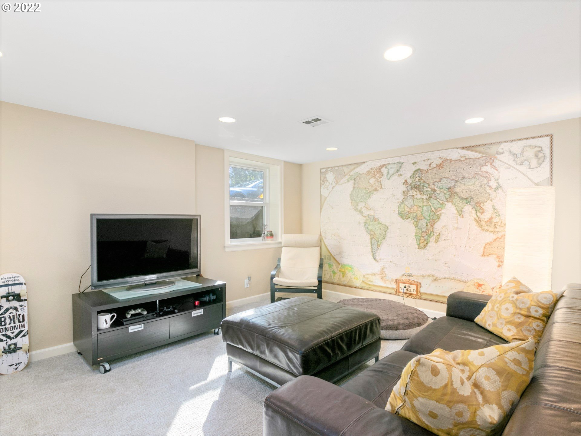 1742 Northeast 60th Avenue Portland, OR 97213 - Photo 25 of 32 a living room with furniture and a flat screen tv