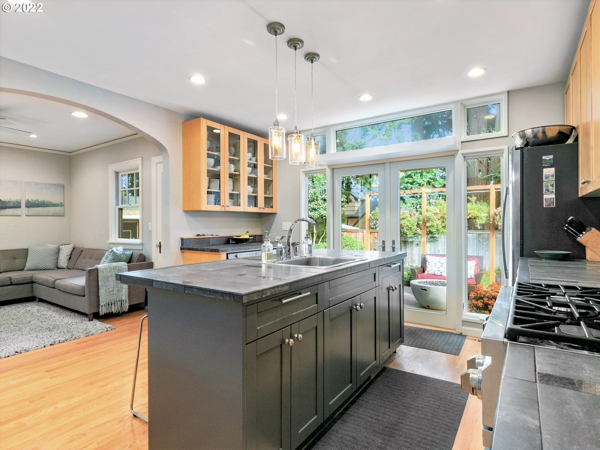 1742 Northeast 60th Avenue Portland, OR 97213 - Photo 9 of 32 a kitchen with stainless steel appliances granite countertop a sink and a stove