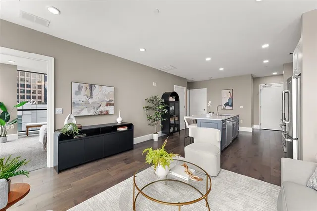a kitchen with stainless steel appliances a sink stove and refrigerator