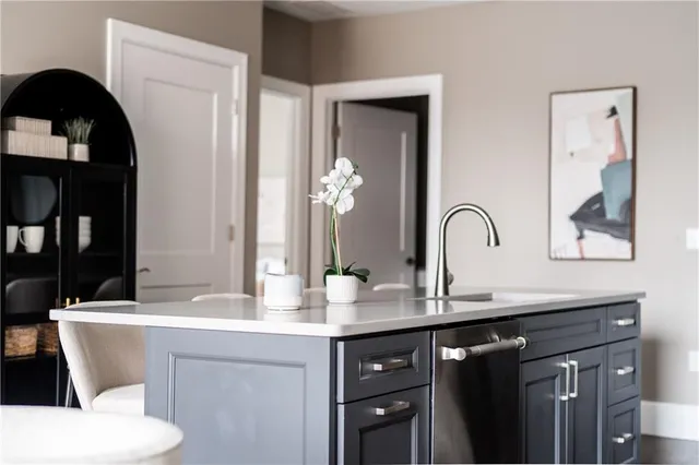 a dining room with chairs and wooden floor