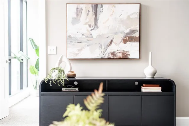 a living room with furniture and a lamp