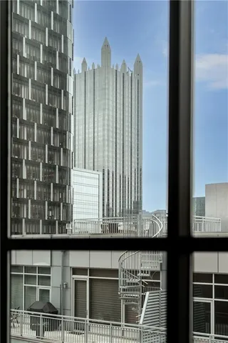 a bedroom with a large bed and a lamp on table