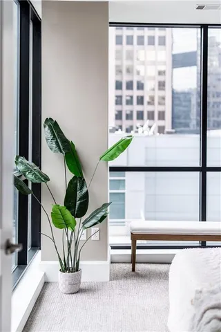 a living room with a table and a window