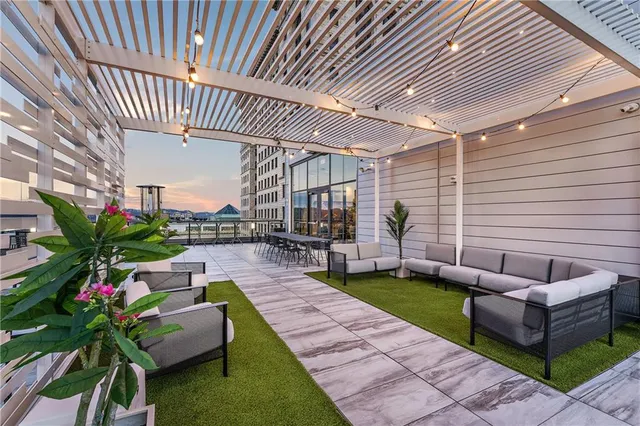 a view of a patio with couches table and chairs