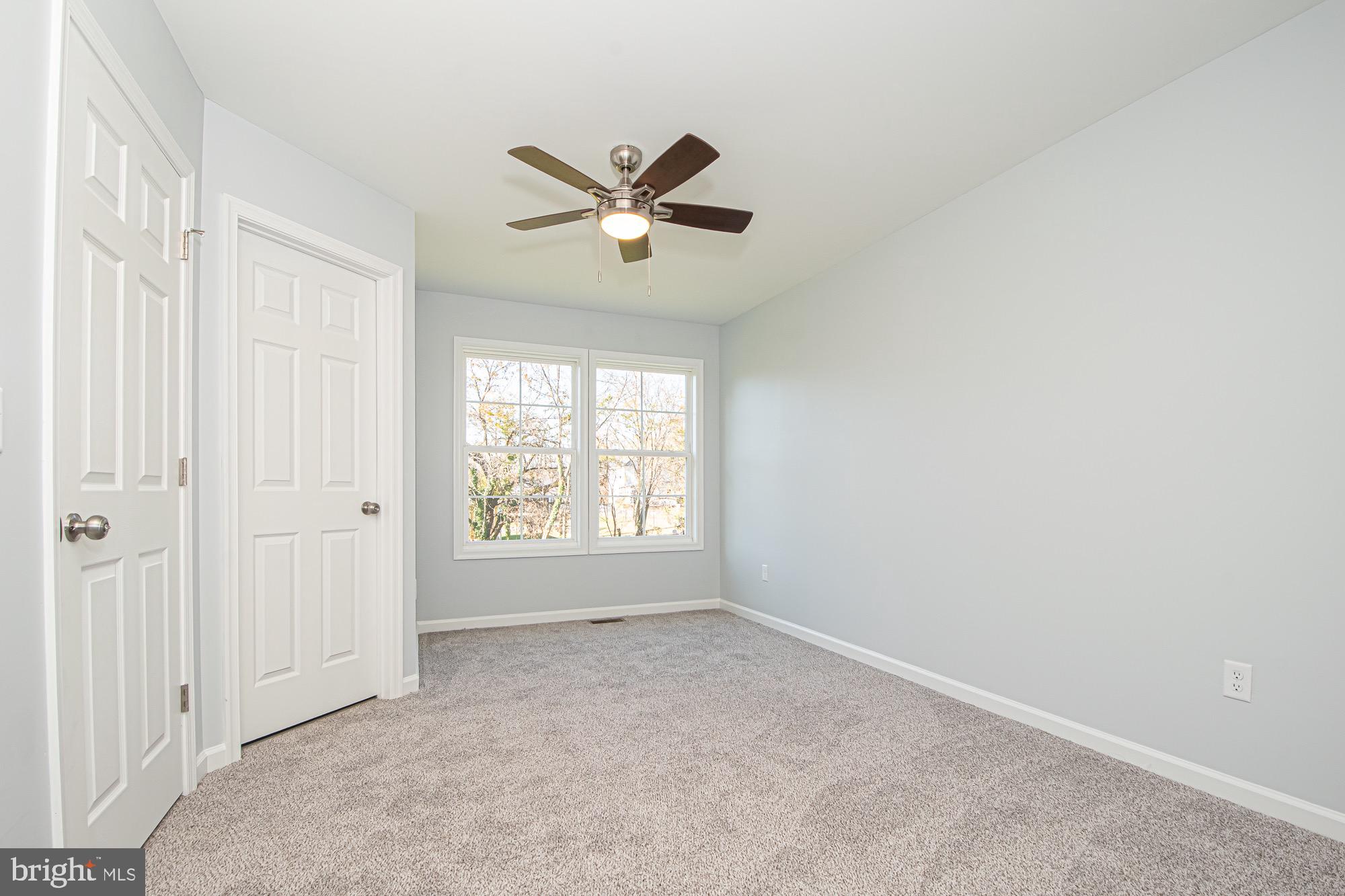 709 Ross Street Winchester, VA 22601 - Photo 19 of 40 an empty room with windows and fan