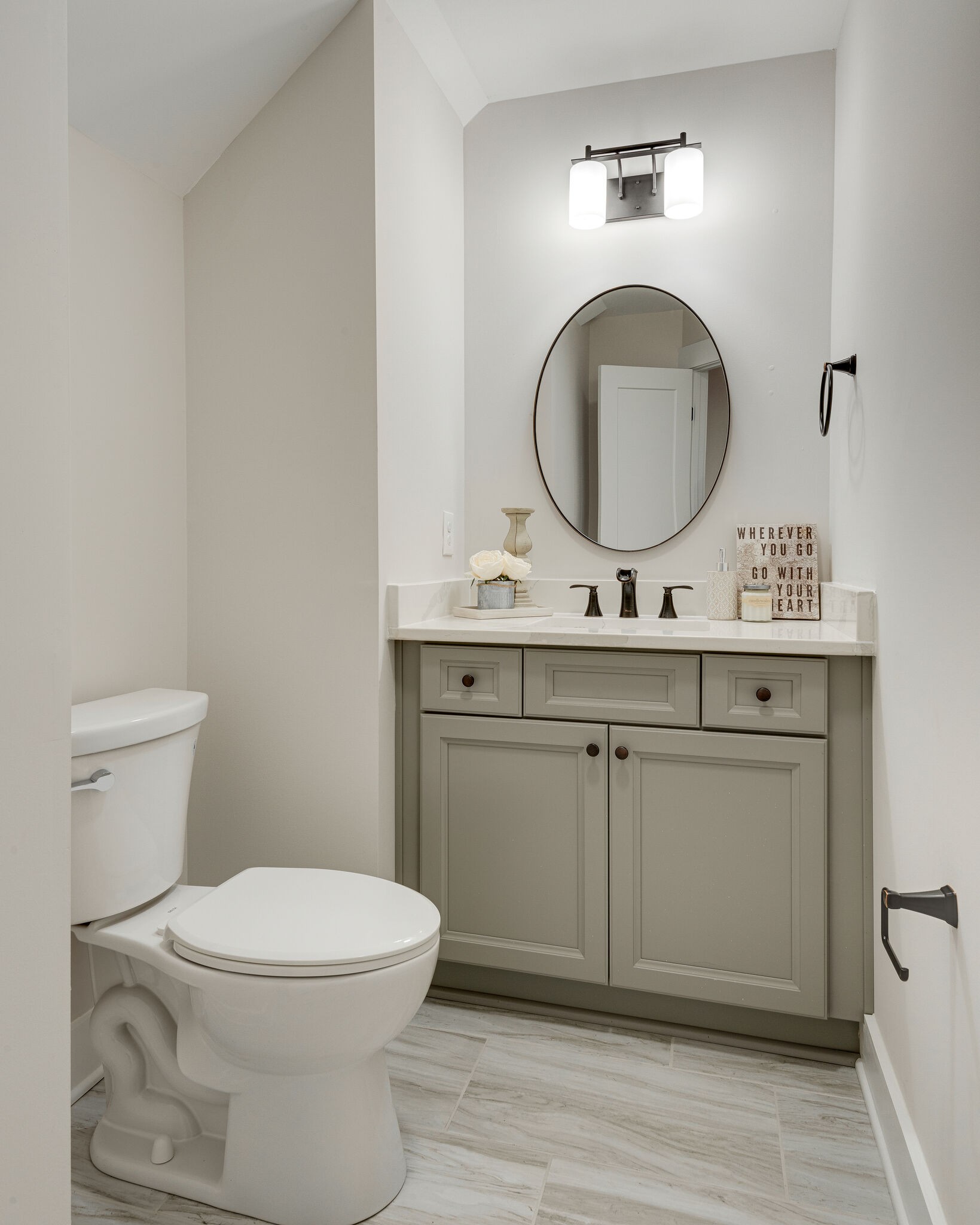 204 Stephen Street Dickson, TN 37055 - Photo 16 of 29 a bathroom with a toilet a sink and a mirror