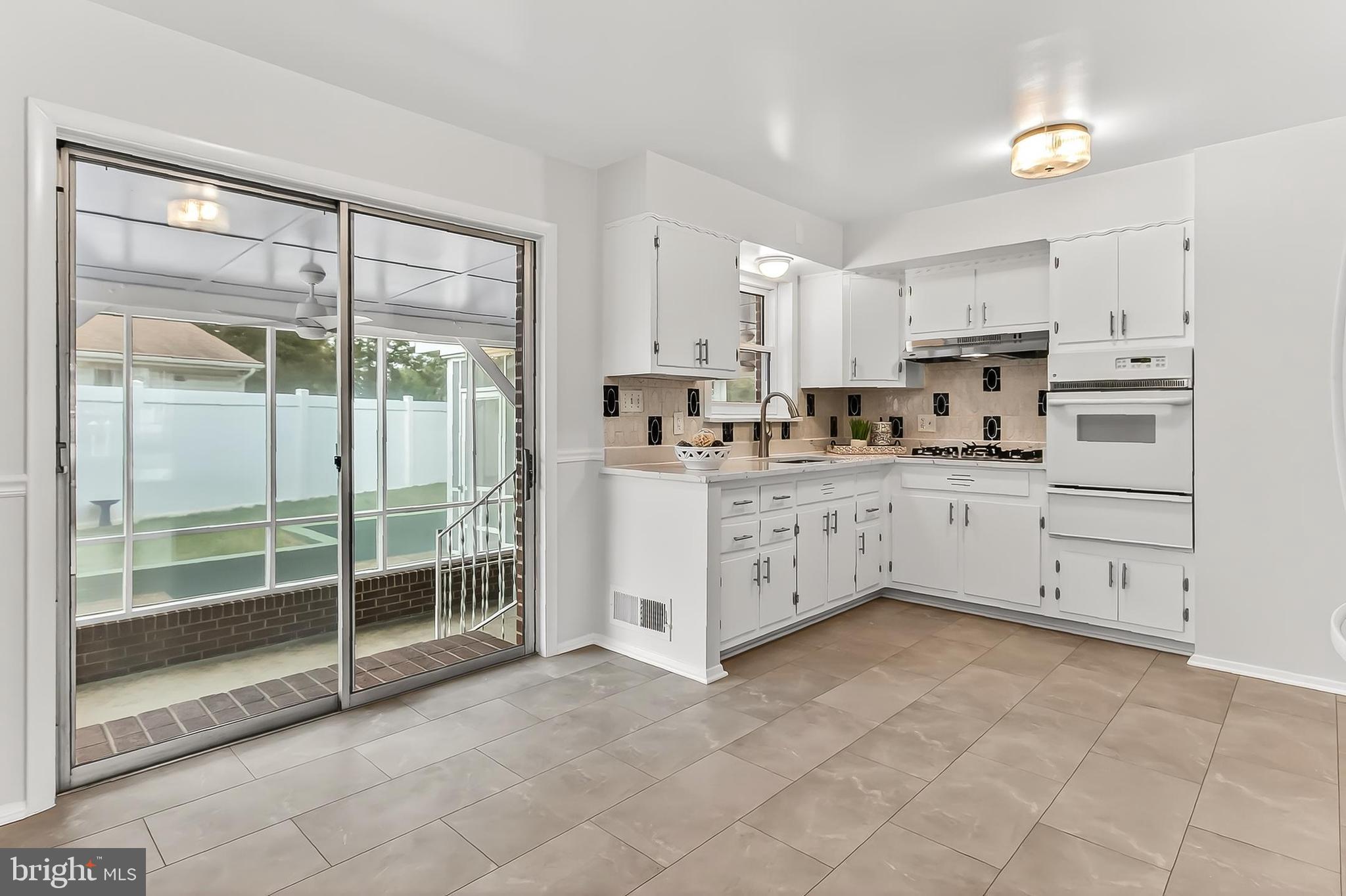 6824 Constance Drive Springfield, VA 22150 - Photo 20 of 67 Kitchen with easy access to screened porch