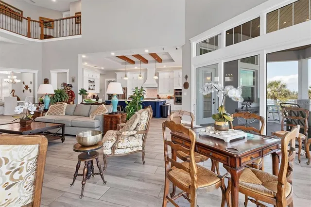 a view of a livingroom with furniture and hardwood floor