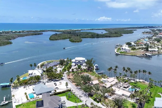 an aerial view of a house with a lake view