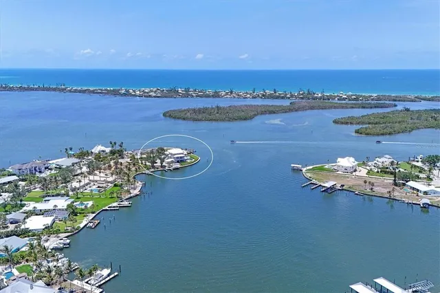 an aerial view of a house with a lake view
