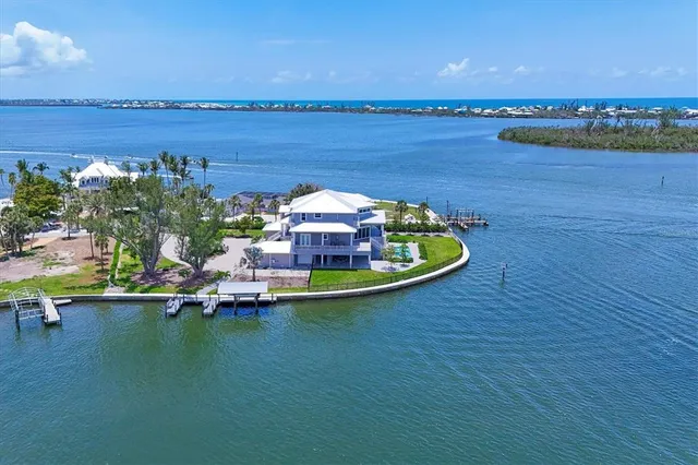 an aerial view of a house with a lake view
