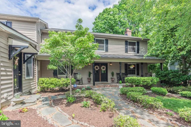 a front view of a house with a porch