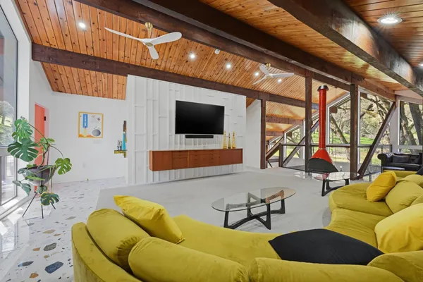 a view of a yard with wooden fence