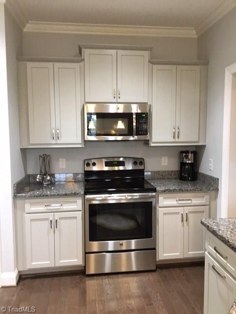 5091 Branch View Road Browns Summit, NC 27214 - Photo 14 of 30 Cooking area with panties on either side.