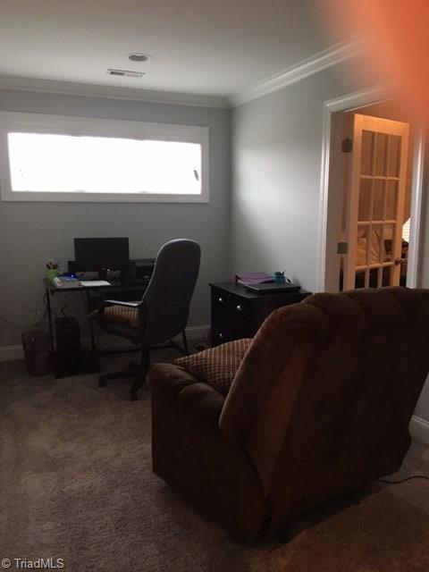 5091 Branch View Road Browns Summit, NC 27214 - Photo 23 of 30 Office area at top of stairway landing with large sunlit window across the top. Bonus room to right w/pane glass panel door.