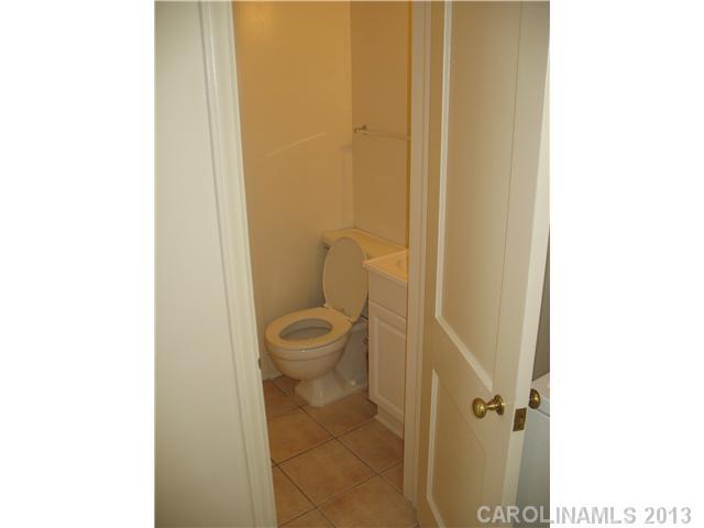 1634 Club Road Charlotte, NC 28205 - Photo 8 of 8 a bathroom with a toilet and a shower