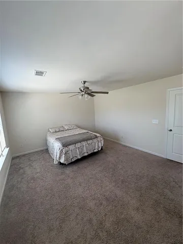 a very nice looking room with a ceiling fan