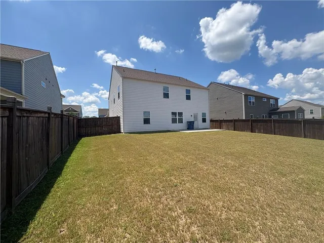 a view of a backyard of a house