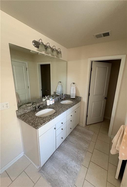 3424 Pratt Way Bethlehem, GA 30620 - Photo 3 of 23 a bathroom with a double vanity sink and mirror