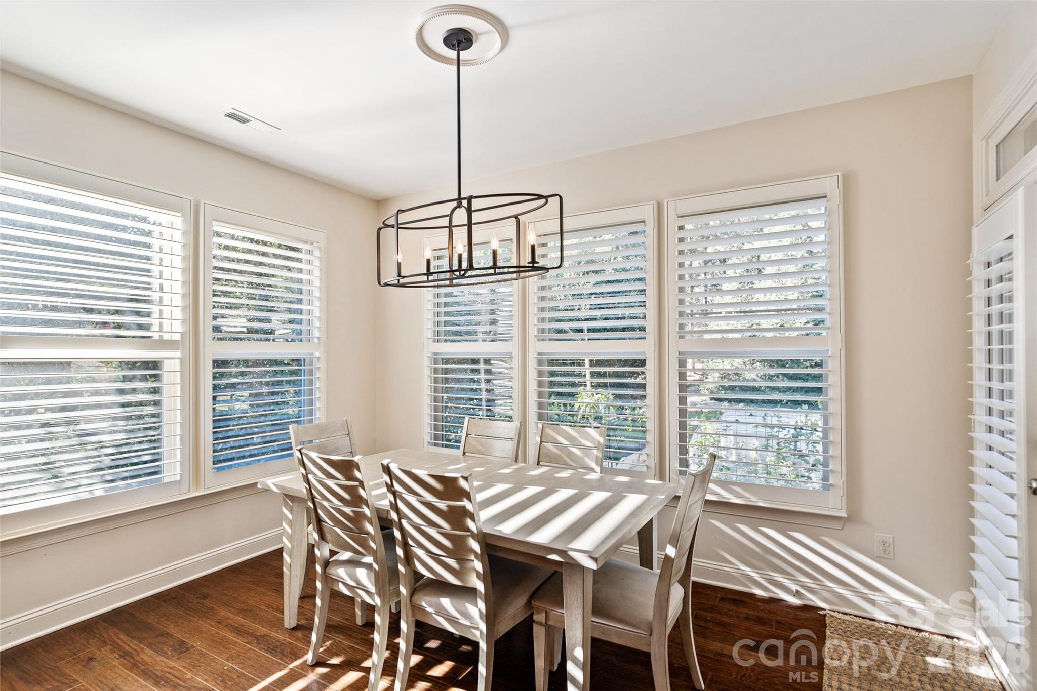 9104 Blue Ridge Drive Indian Land, SC 29707 - Photo 13 of 41 a view of a dining room with furniture window and wooden floor