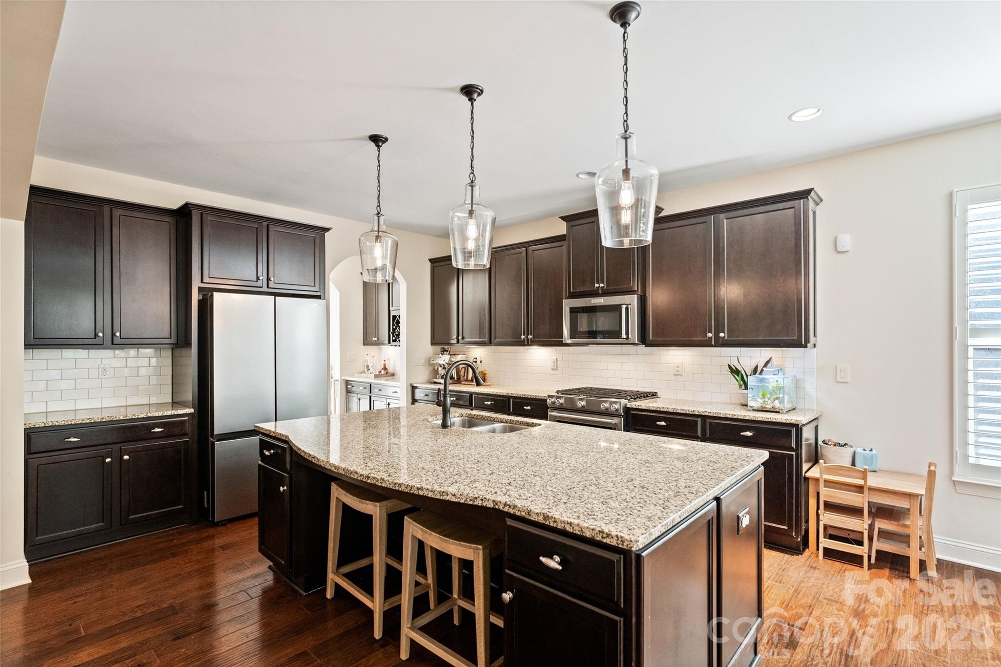 9104 Blue Ridge Drive Indian Land, SC 29707 - Photo 15 of 41 a kitchen with stainless steel appliances granite countertop a sink a stove and refrigerator