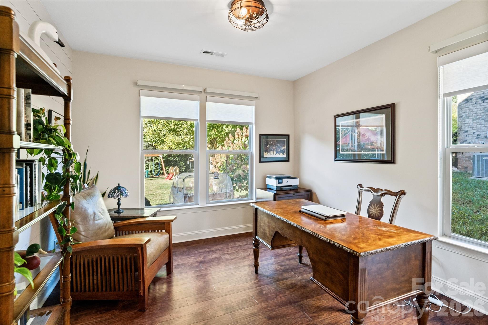 9104 Blue Ridge Drive Indian Land, SC 29707 - Photo 19 of 41 a living room with furniture a flat screen tv and a window