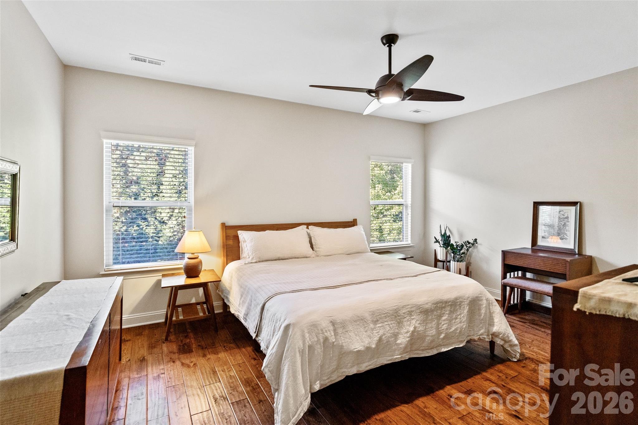 9104 Blue Ridge Drive Indian Land, SC 29707 - Photo 25 of 41 a bedroom with a bed and wooden floor