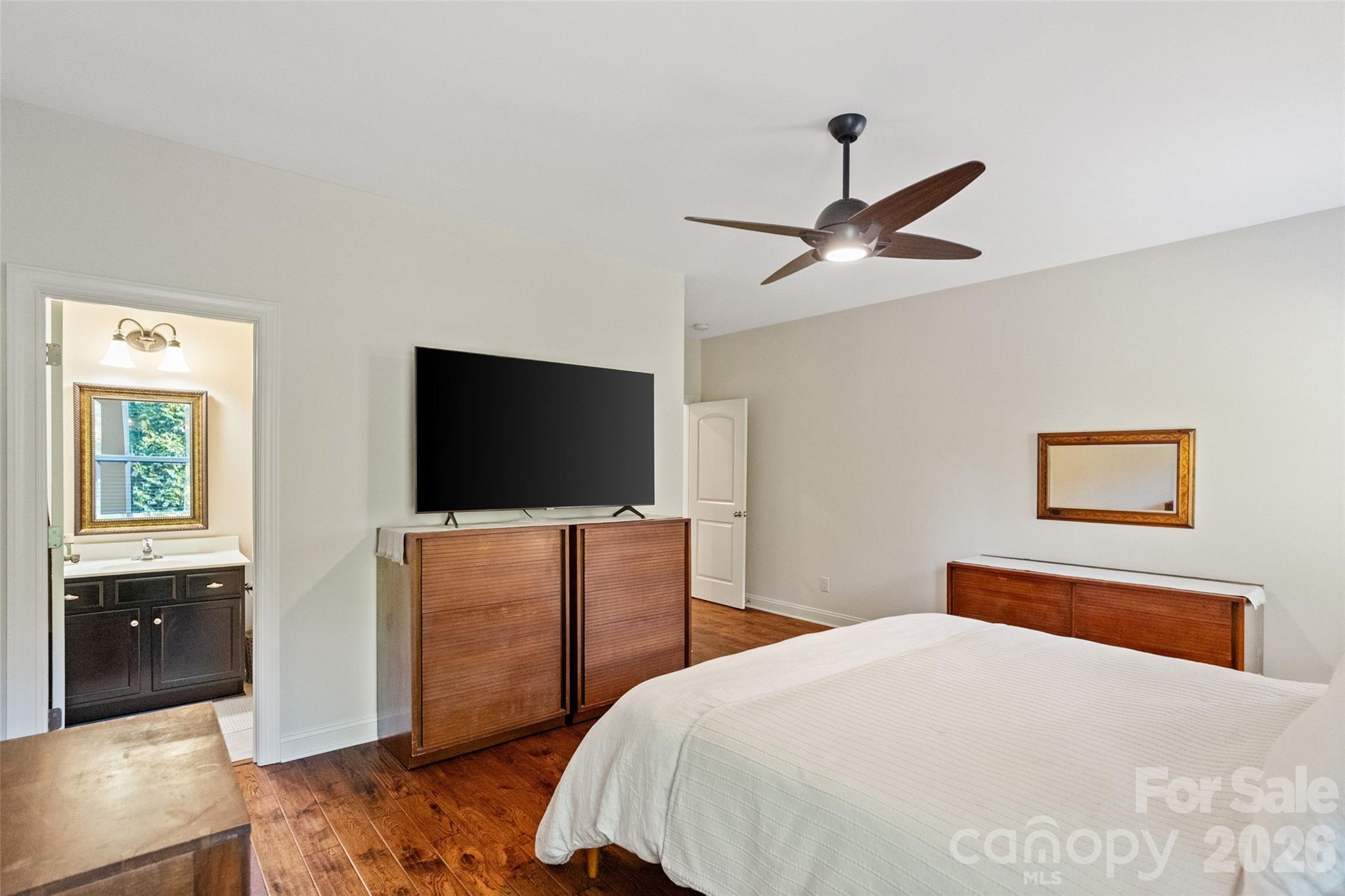 9104 Blue Ridge Drive Indian Land, SC 29707 - Photo 26 of 41 a bedroom with a bed and a flat screen tv