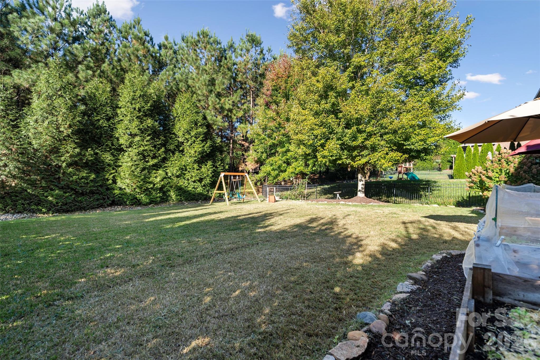 9104 Blue Ridge Drive Indian Land, SC 29707 - Photo 36 of 41 a view of a tree in a yard