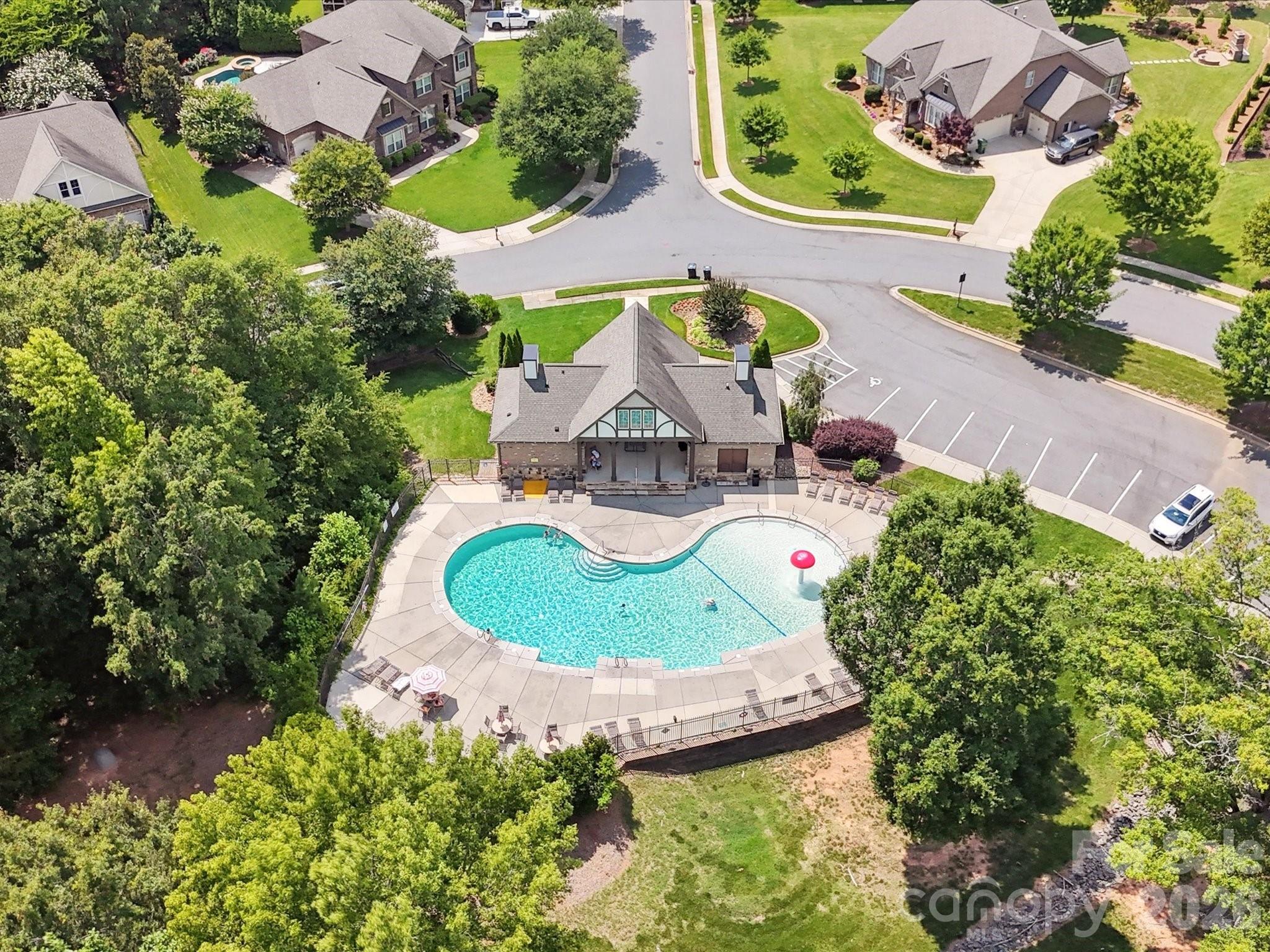 9104 Blue Ridge Drive Indian Land, SC 29707 - Photo 38 of 41 an aerial view of a house with garden space and a swimming pool