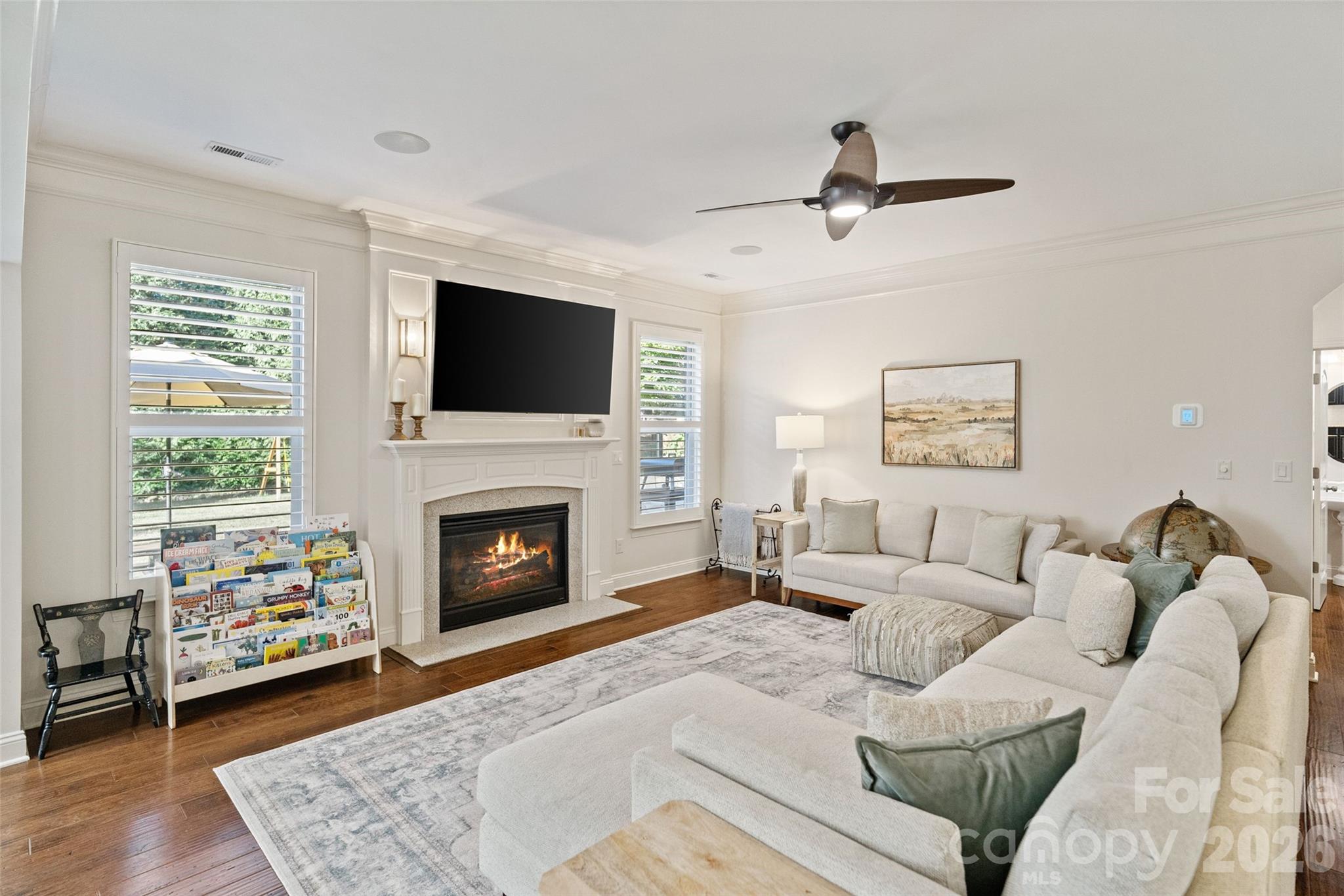 9104 Blue Ridge Drive Indian Land, SC 29707 - Photo 8 of 41 a living room with furniture a fireplace and a flat screen tv