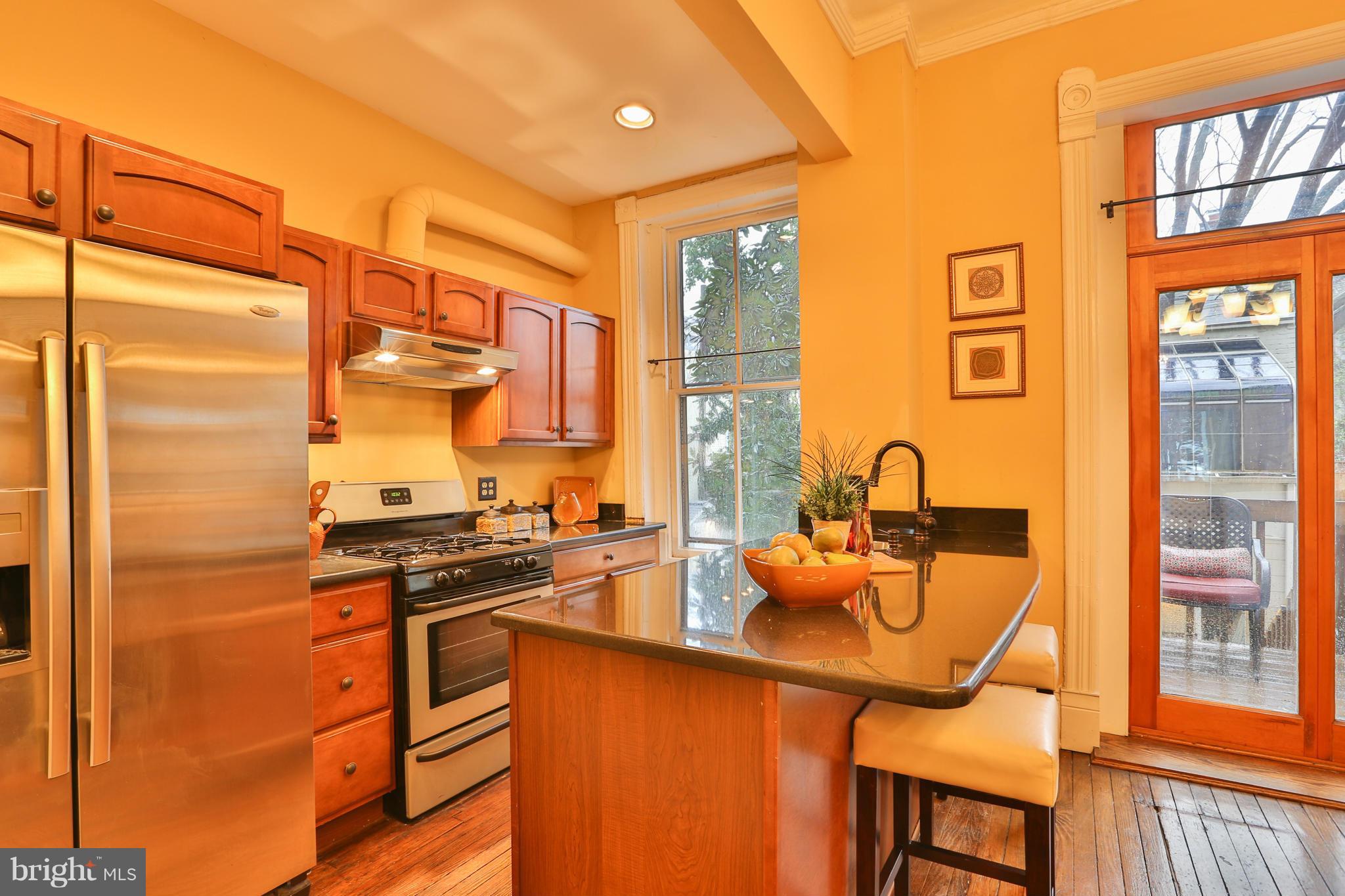 436 New Jersey Avenue Southeast Washington, DC 20003 - Photo 6 of 13 a kitchen with stainless steel appliances granite countertop a stove and a refrigerator