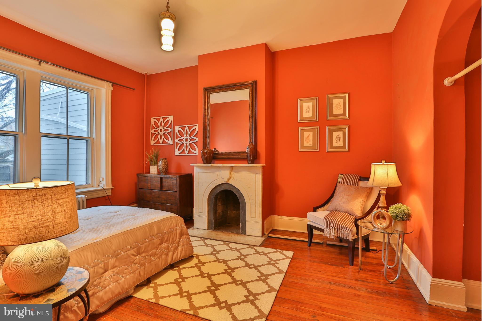 436 New Jersey Avenue Southeast Washington, DC 20003 - Photo 9 of 13 a bedroom with furniture and a fireplace